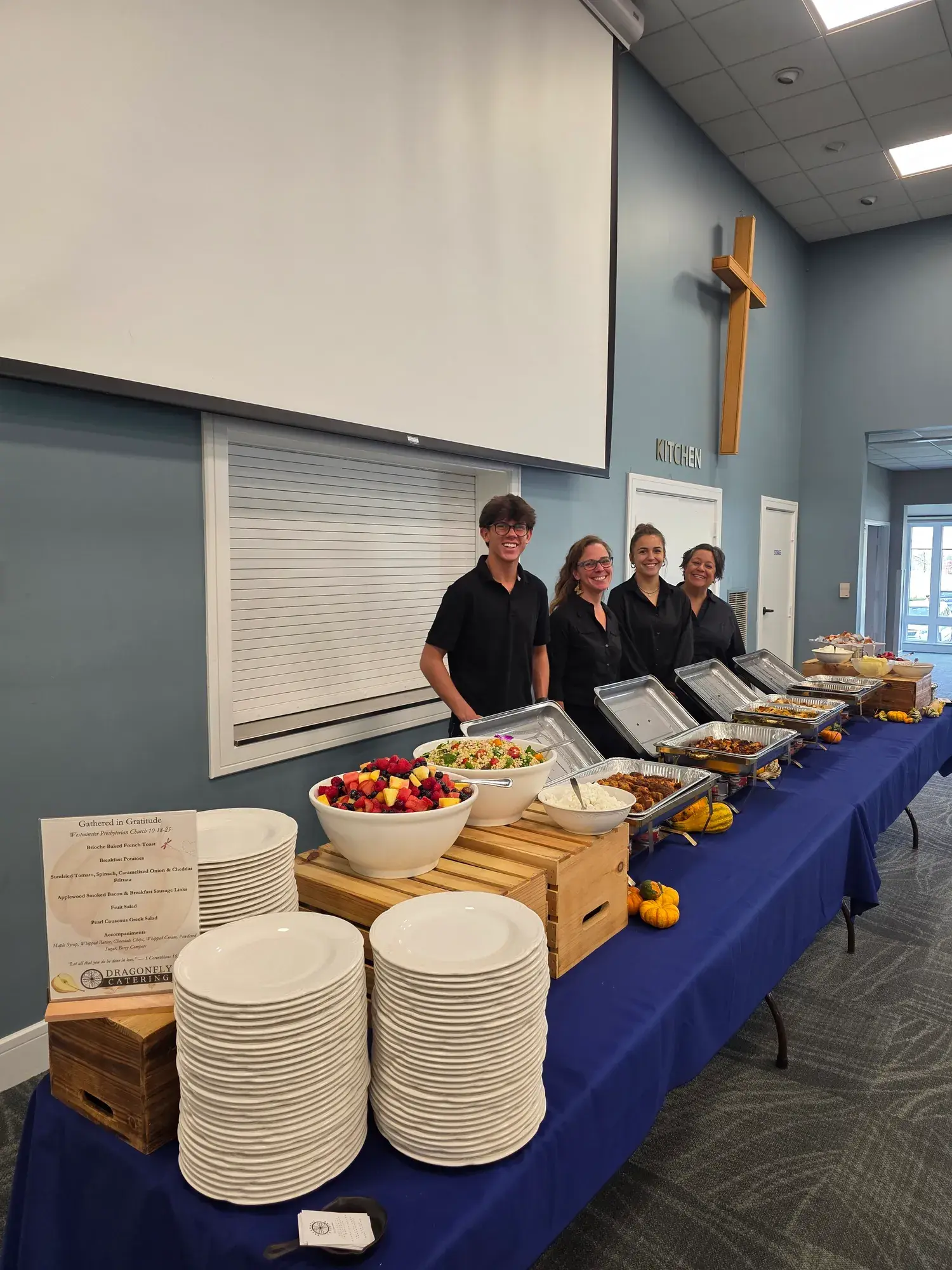 The Dragonfly Catering team serving guests at a buffet