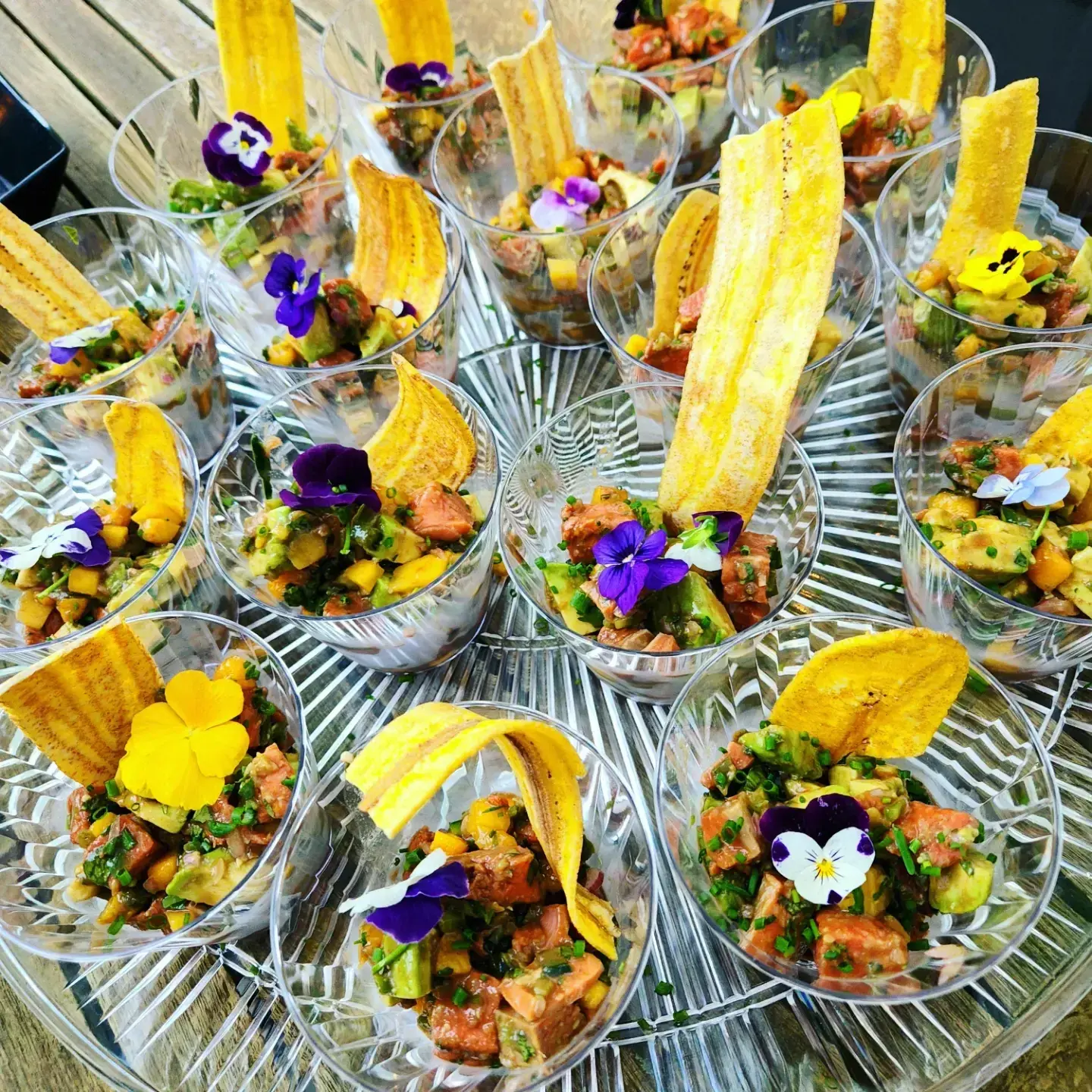 Individual savory appetizer cups finished with edible flowers