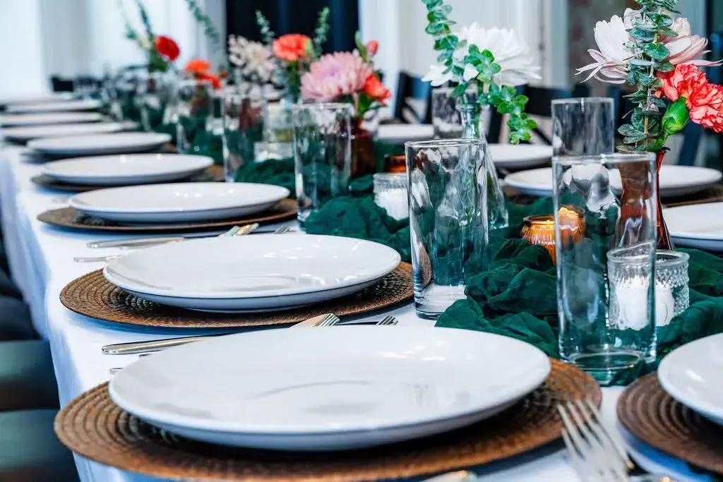 A polished table setting prepared for a private catered event
