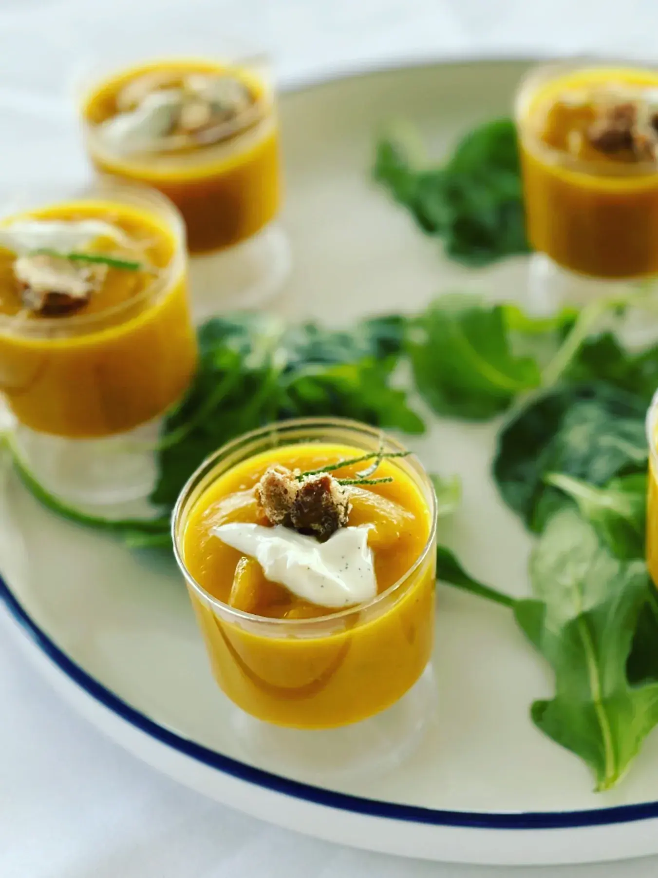 Seasonal soup shooters prepared for passed service