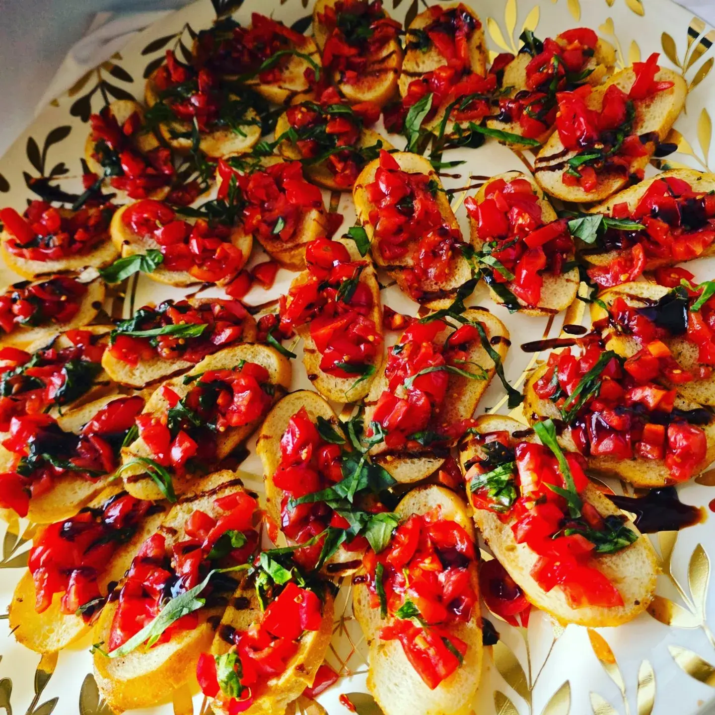 Tomato bruschetta arranged on trays for catered service