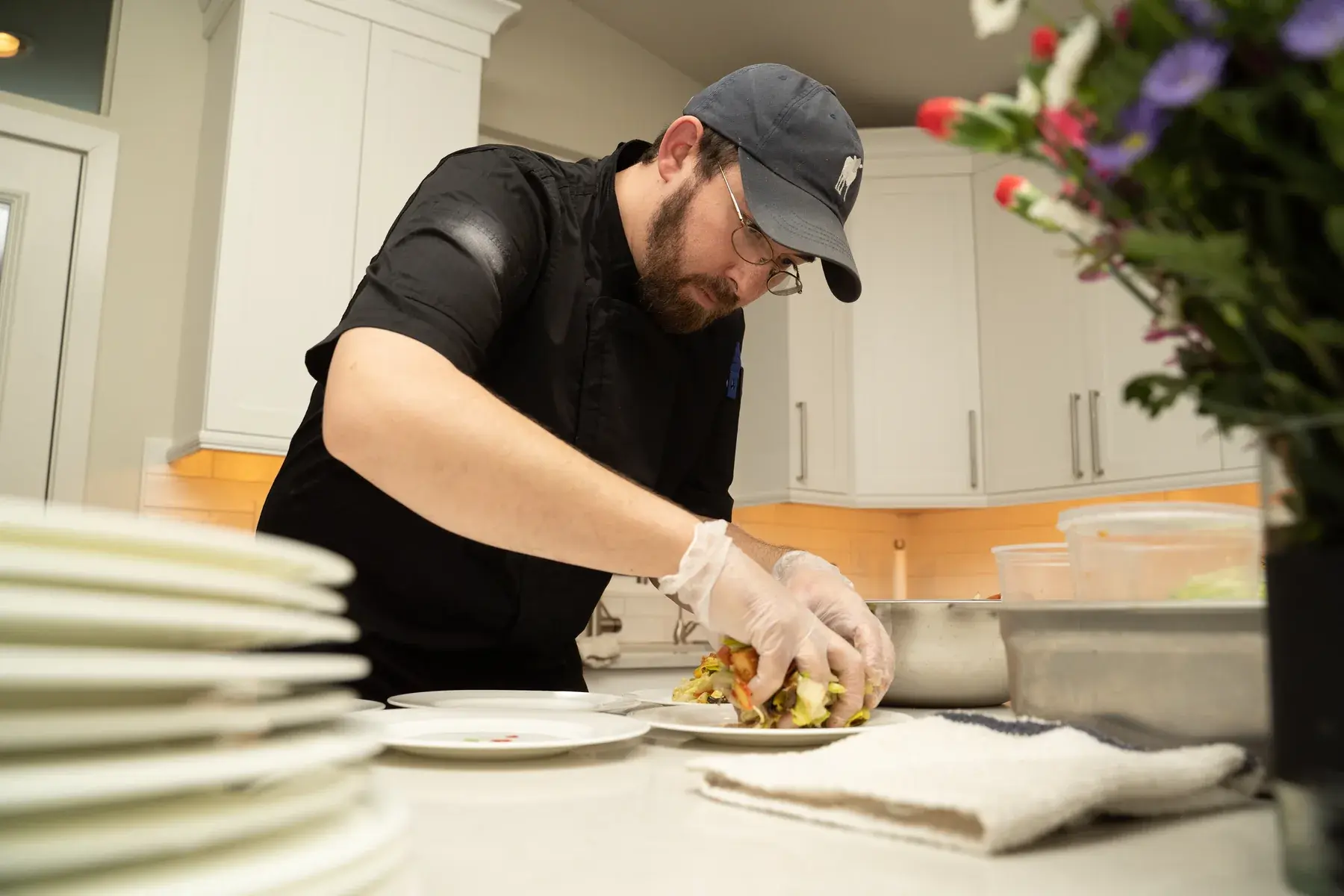 Chef Matt plating a meal for a private event