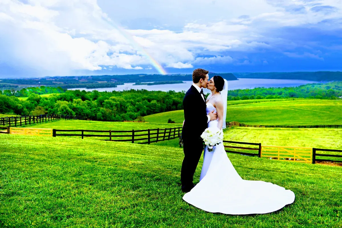 A wedding couple overlooking the Susquehanna River at Lauxmont Farms