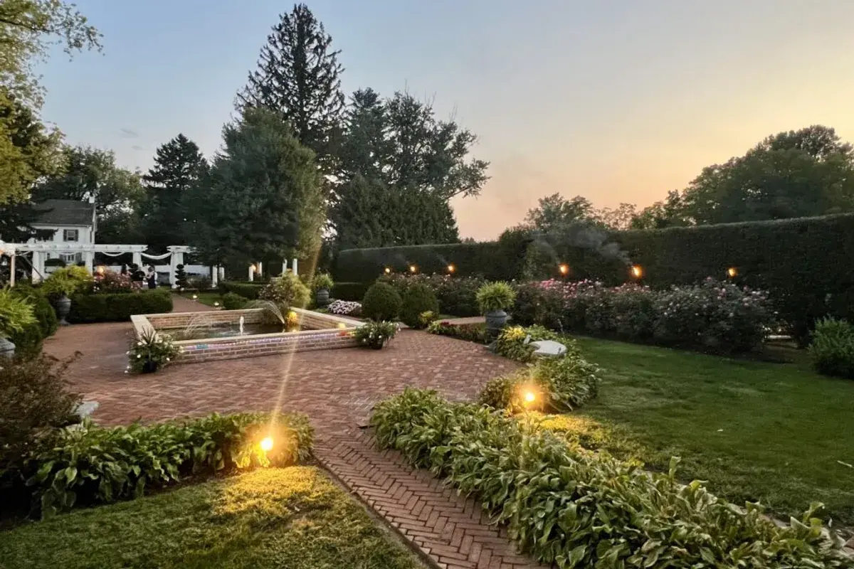 The illuminated garden courtyard at White Chimneys Estate