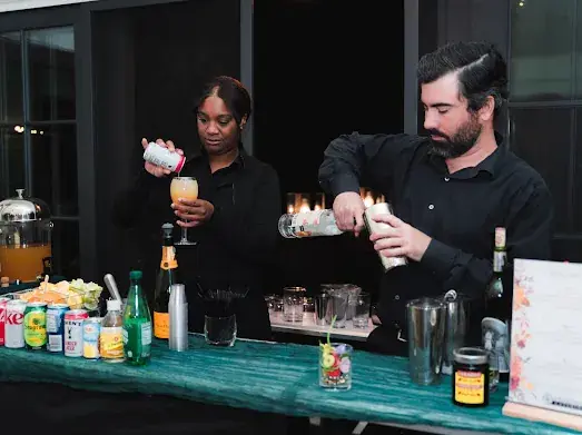 A Dragonfly bartender preparing drinks for event guests