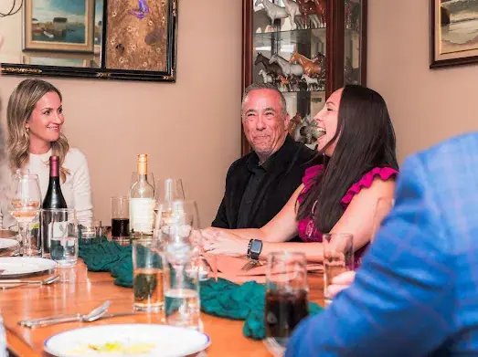 Guests enjoying conversation during a Dragonfly private dinner